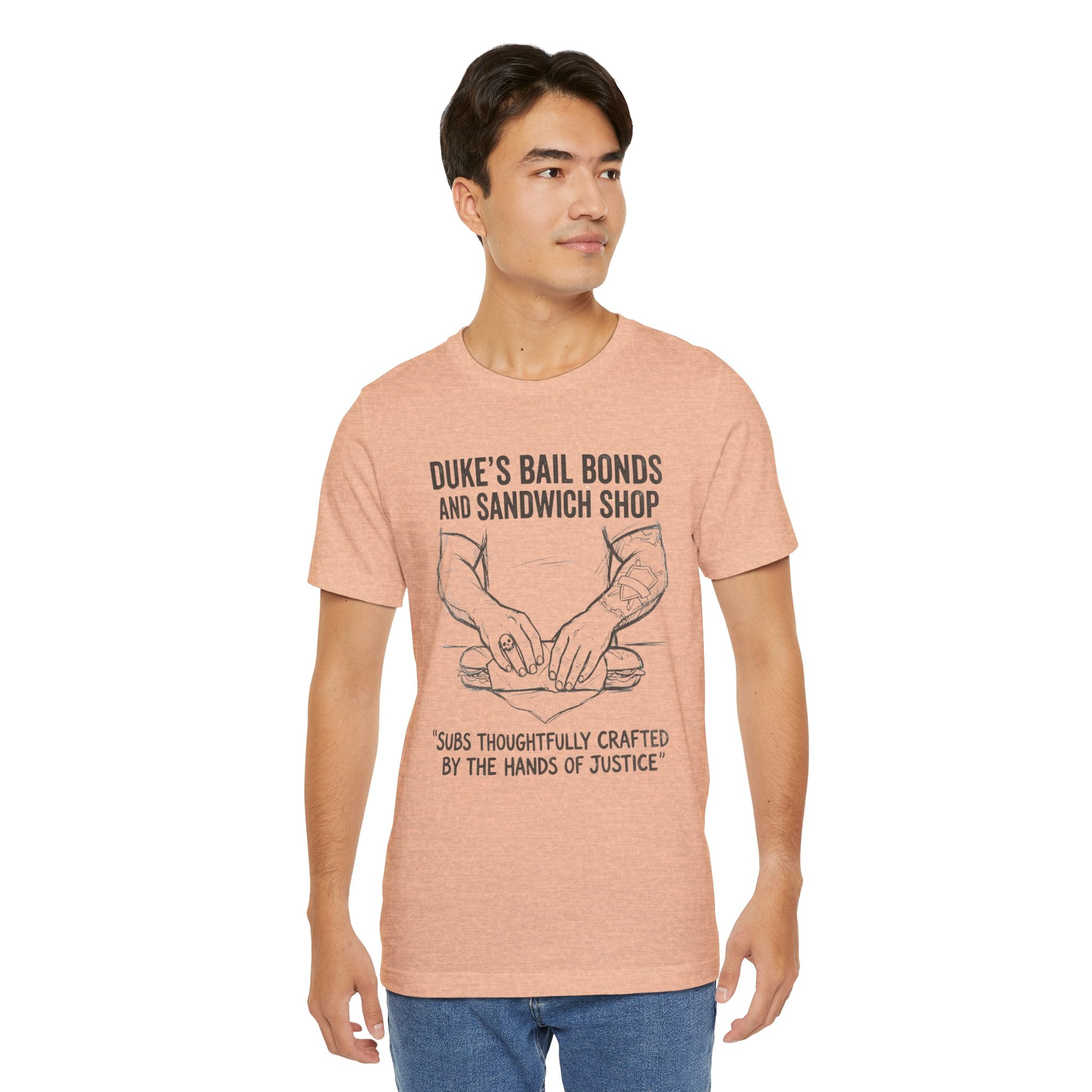 Duke's Bail Bonds & Sandwich Shop Tee — "Subs Thoughtfully Crafted by the Hands of Justice" Graphic Shirt