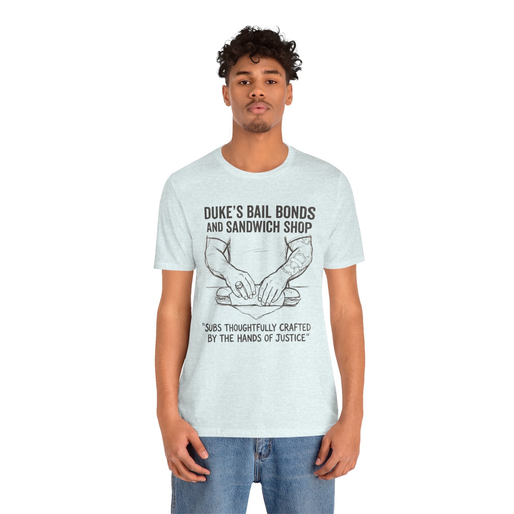 Duke's Bail Bonds & Sandwich Shop Tee — "Subs Thoughtfully Crafted by the Hands of Justice" Graphic Shirt