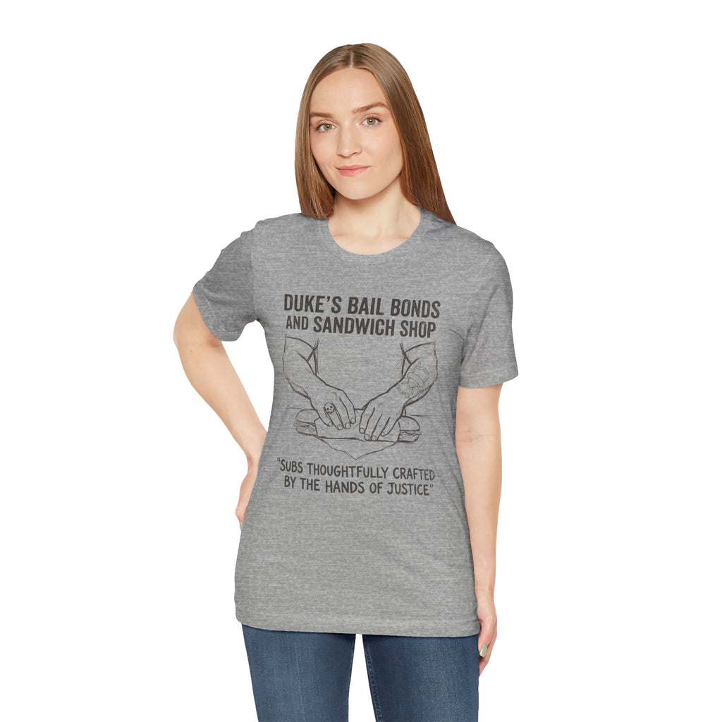 Duke's Bail Bonds & Sandwich Shop Tee — "Subs Thoughtfully Crafted by the Hands of Justice" Graphic Shirt